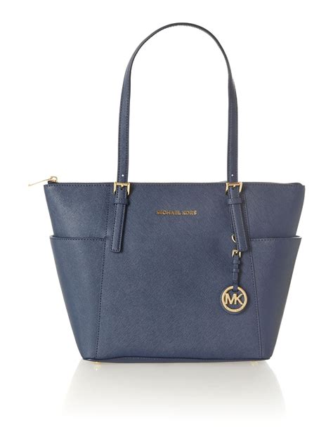 michael kors navy bag jet set|Michael Kors jet set airplane.